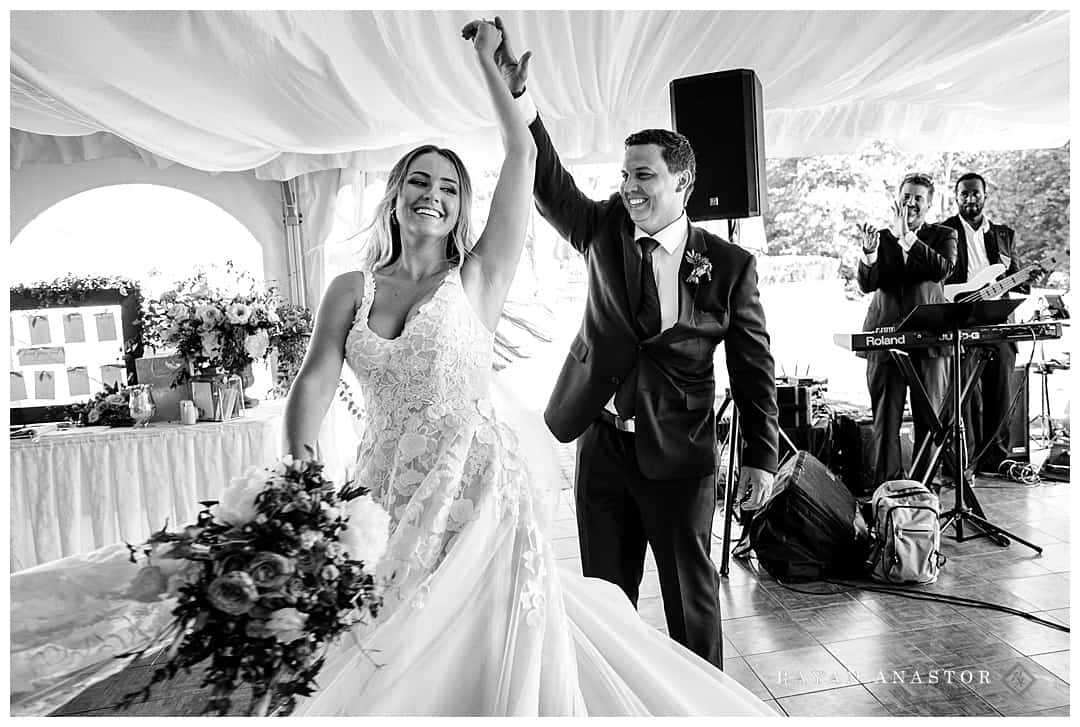 bride and groom entering reception