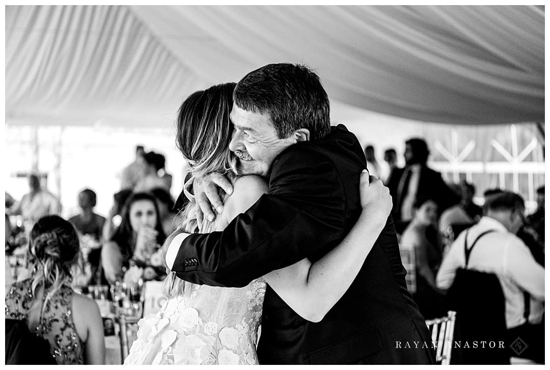 father daughter hug at wedding