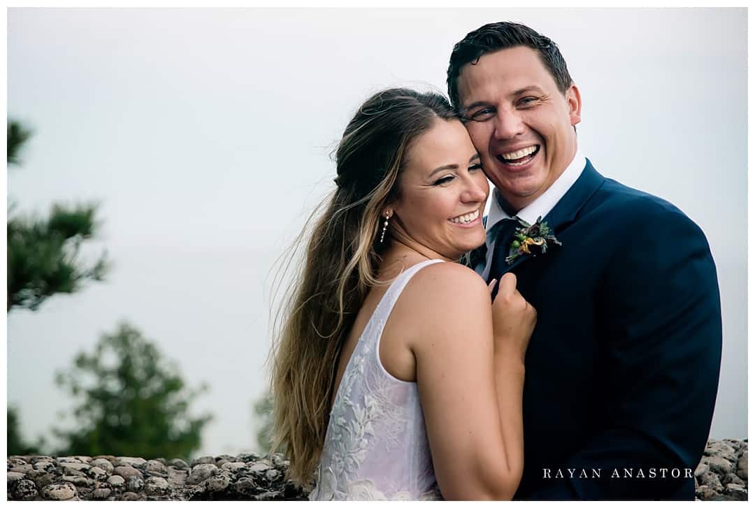 bride and groom laughing