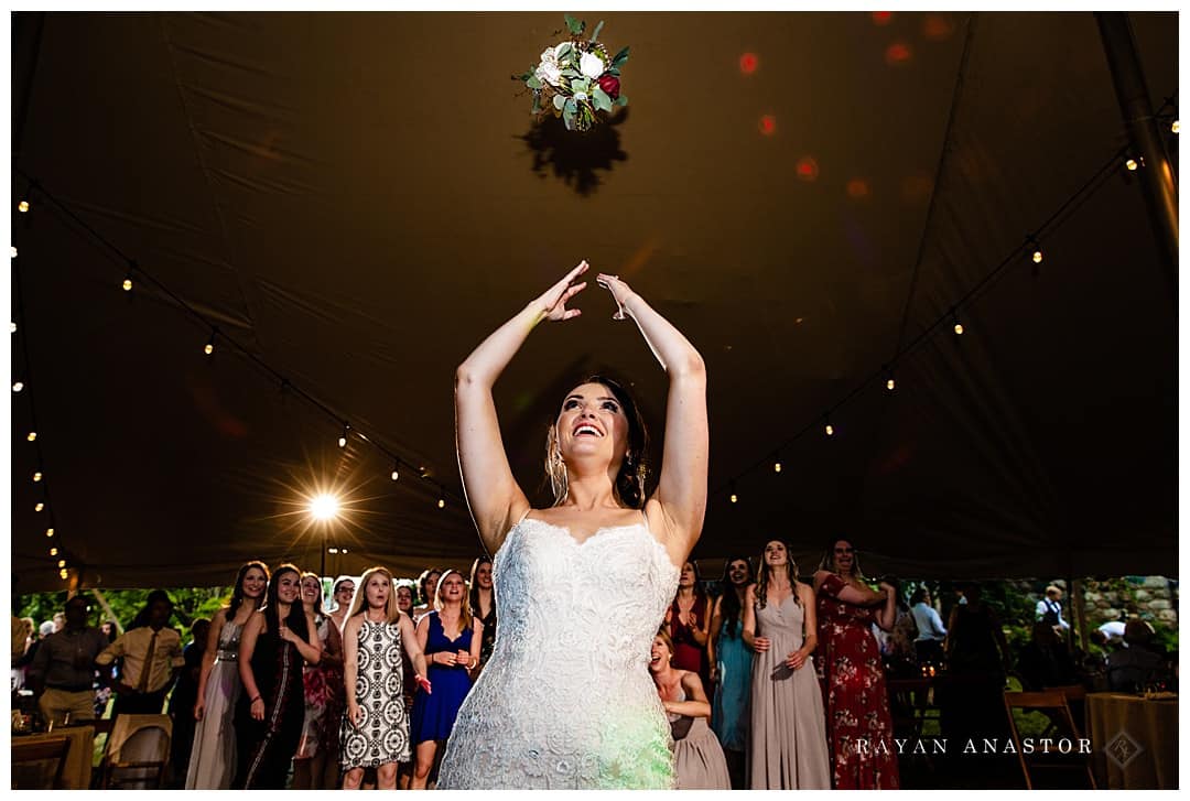 bride tossing bouquet