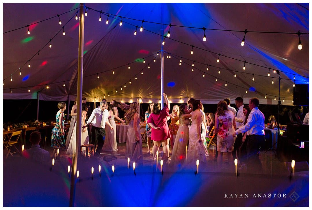 wedding reception under tent with twinkle lights