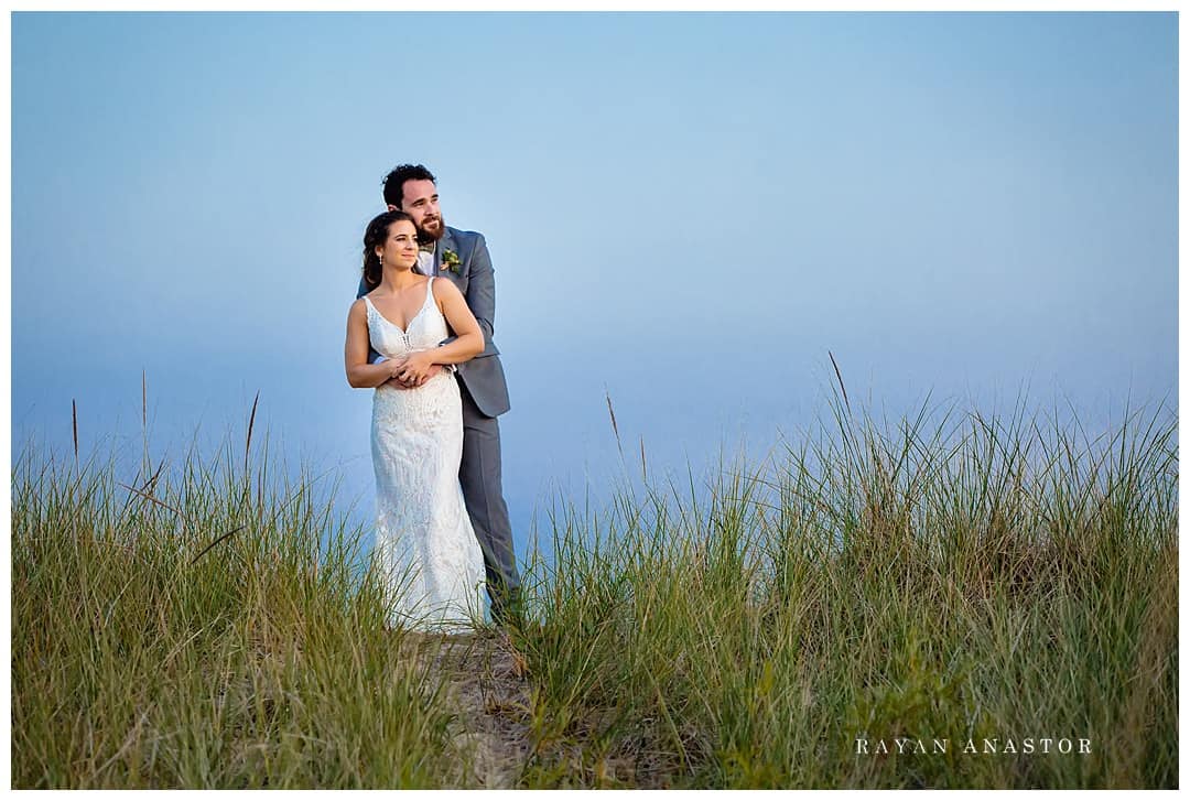 bride and groom watching sunset in Frankfort