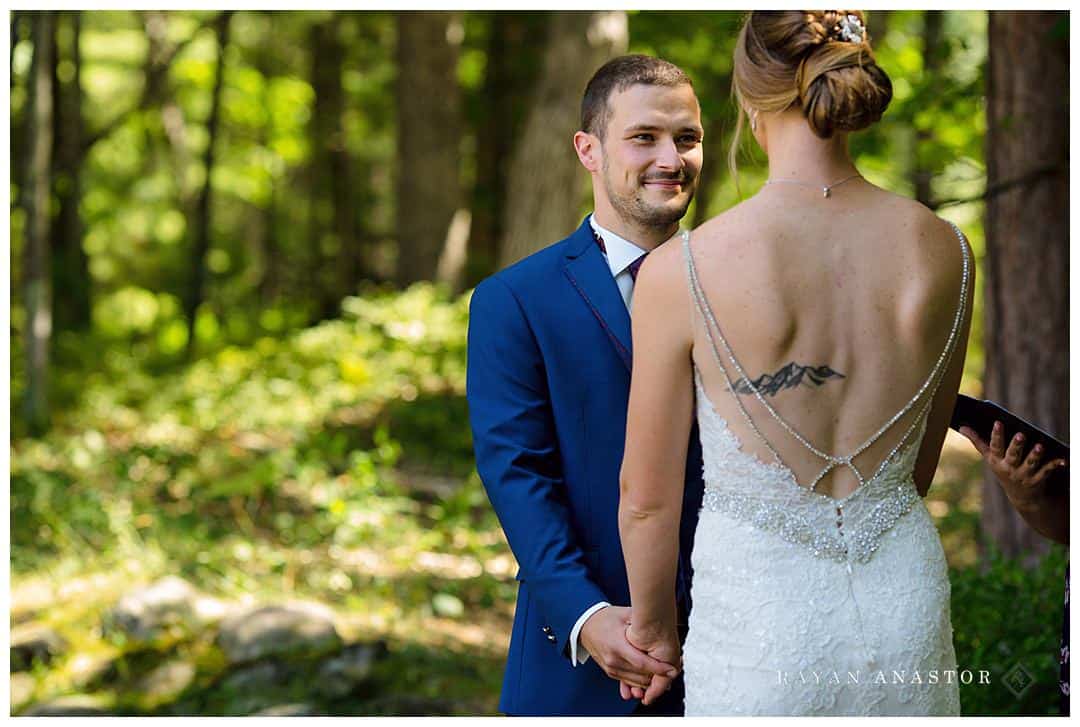 groom smiling at bride