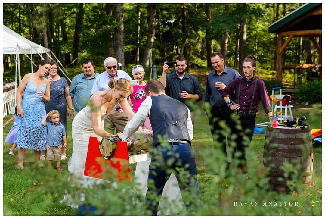 sawing log at German wedding