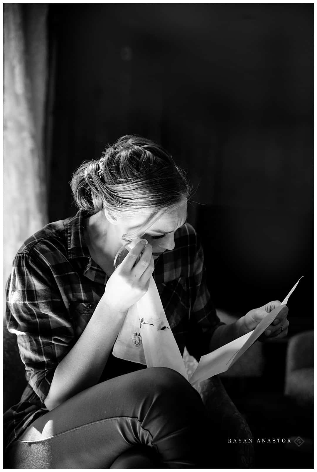 bride crying reading letter from groom