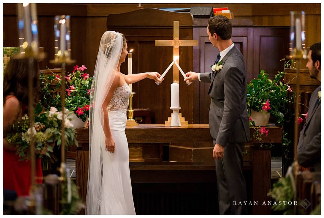 bride and groom lighting unity candle