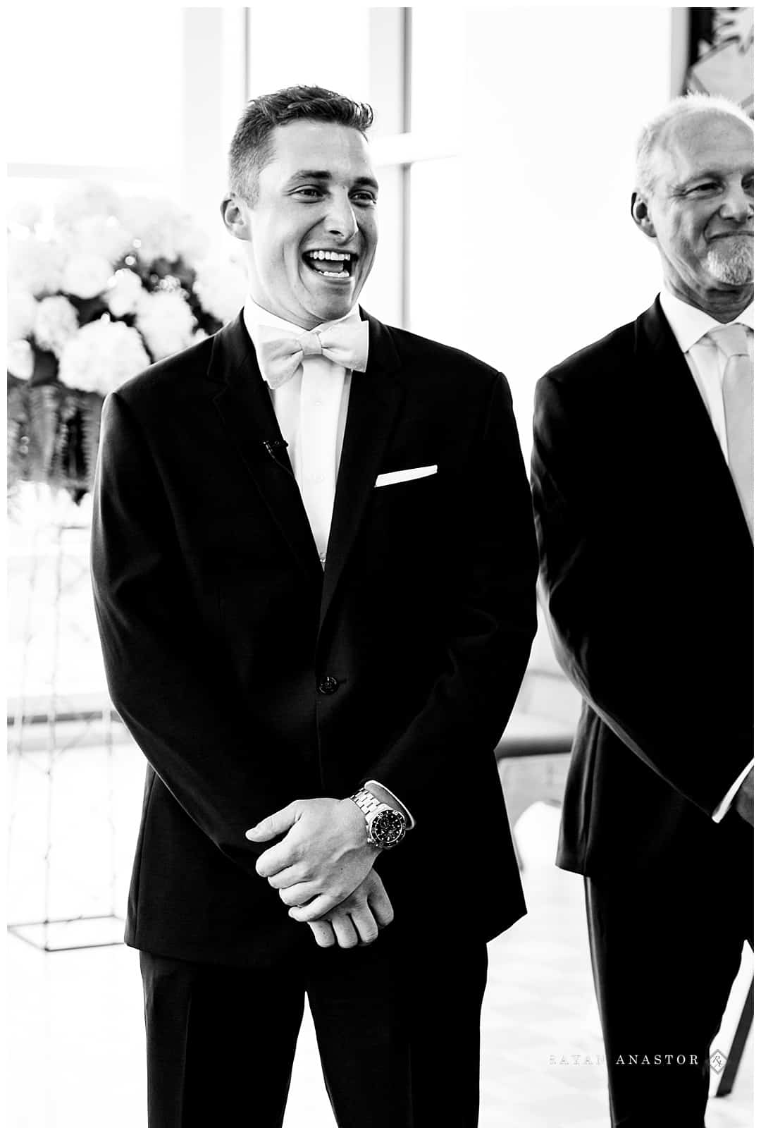 grooms smile as he sees bride for the first time