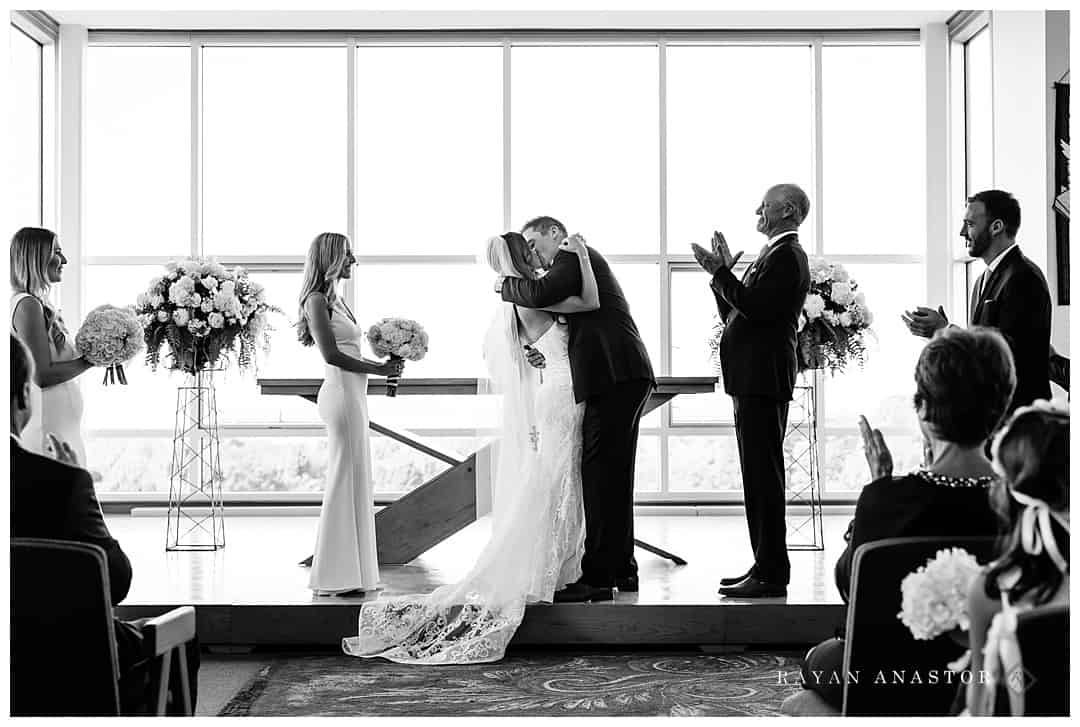 bride and groom kiss