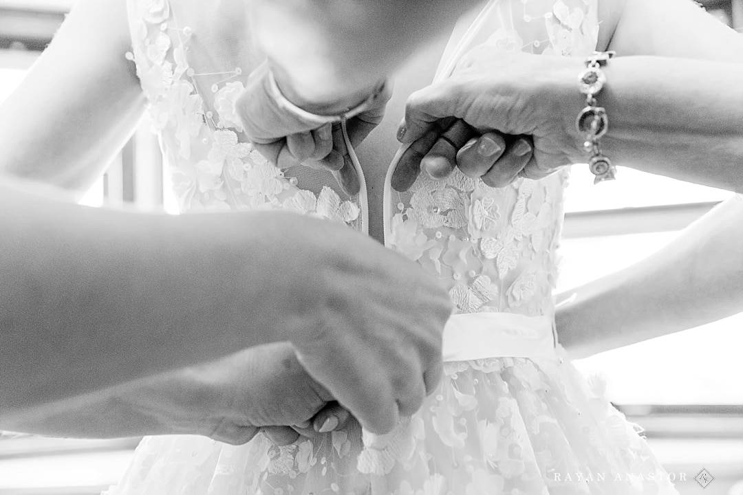 zipping up BHLDN wedding dress