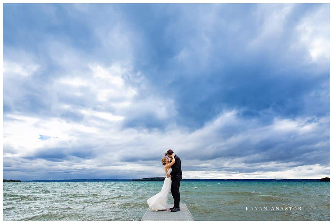 Wedding portraits on Grand Traverse Bay with storm rolling in