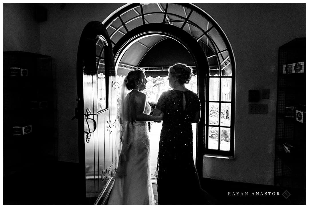 bride and mom getting ready to walk down the aisle