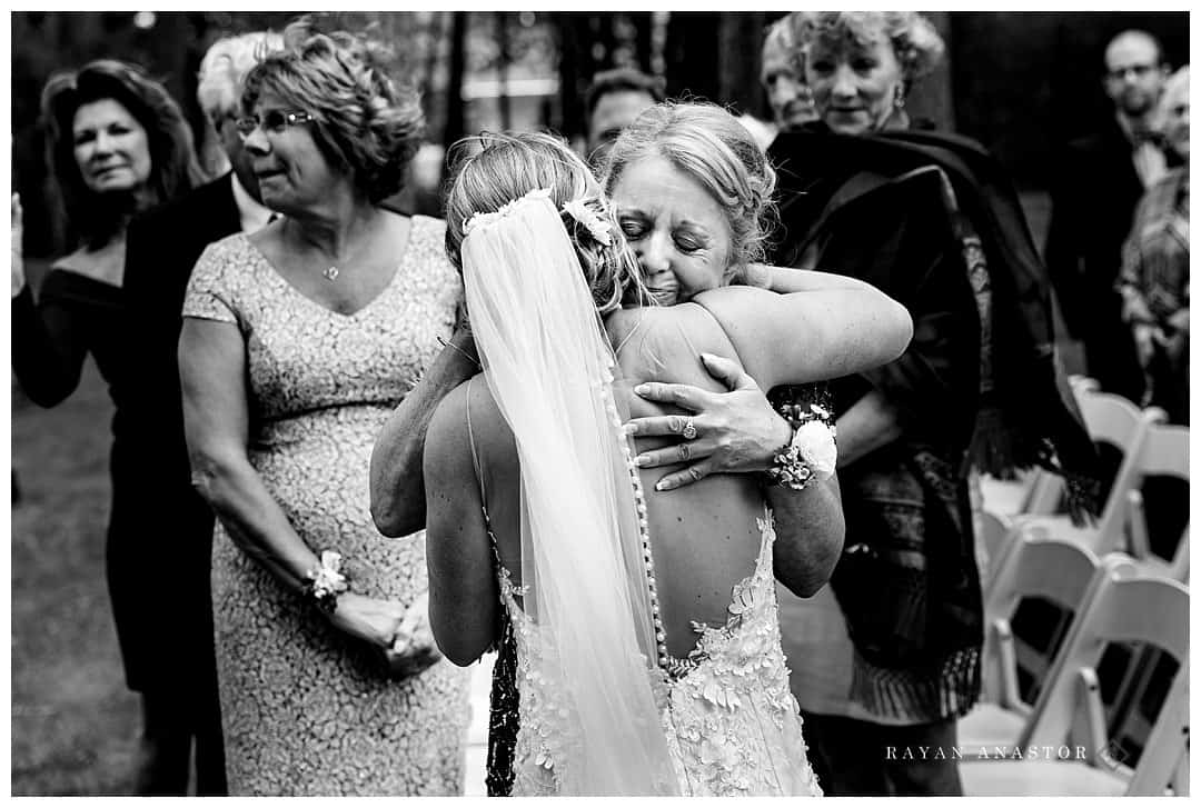 mom hugging bride
