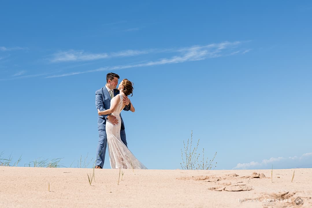 bride and groom portraits in sand dunes