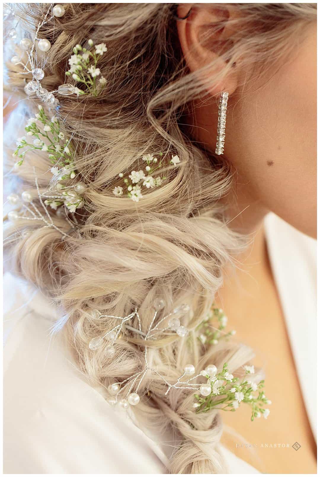 bridal hair braid with flowers interwoven