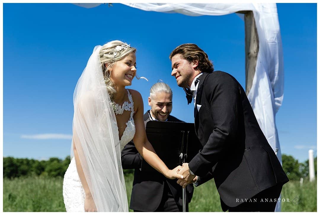 bride and groom laughing