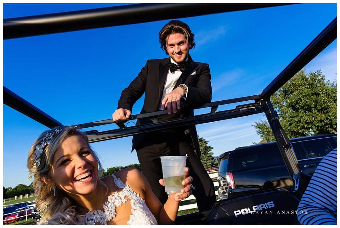 bride and groom in 4 wheeler heading out for photos