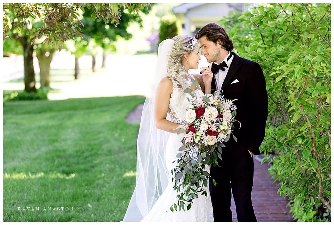 Bride and groom at old farm house