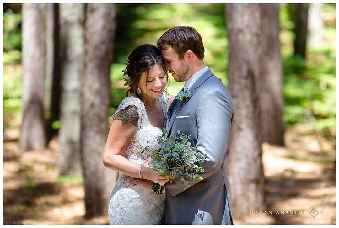 bride and groom in pine forest