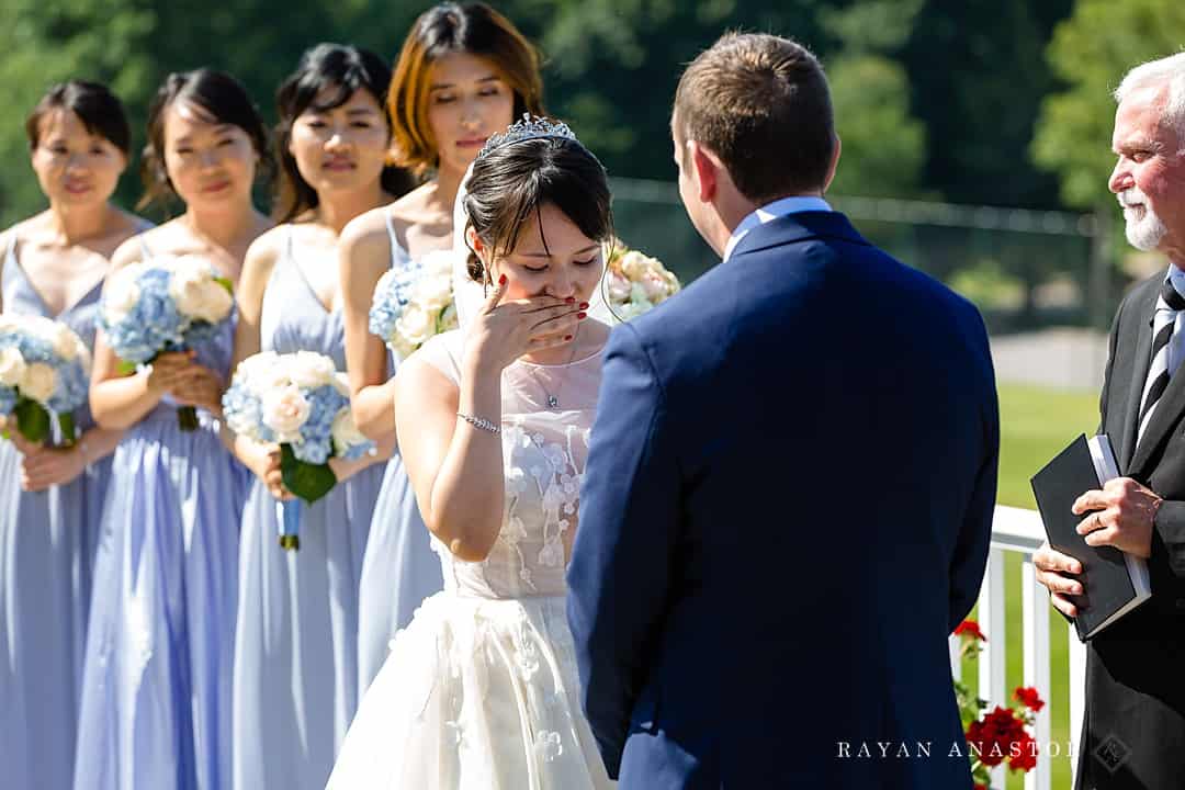 Bride crying during wedding at Lake Leelanau