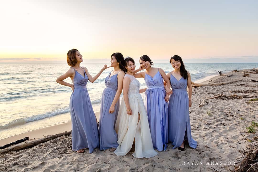 bridesmaids on Lake Michigan at sunset in Leland