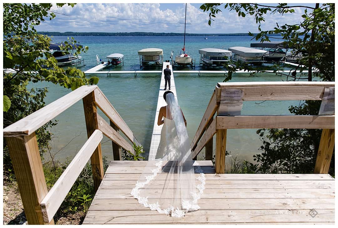 first look with groom on torch lake