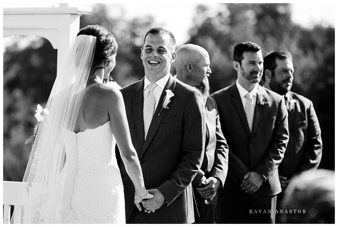 groom laughing at wedding