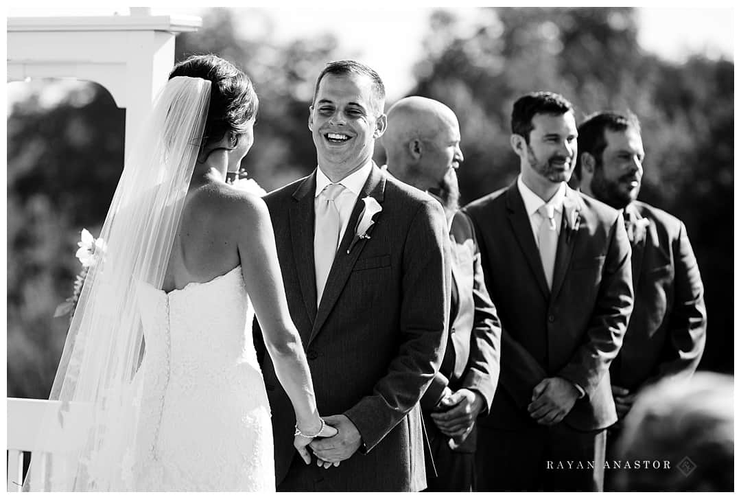 groom laughing at wedding