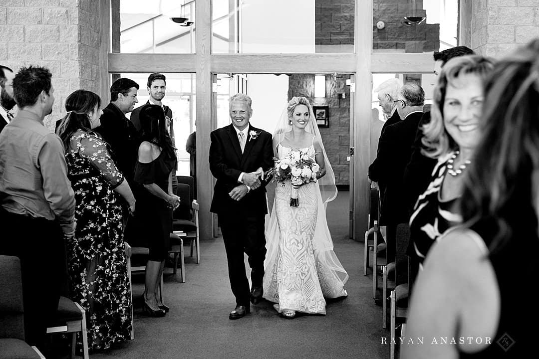 bride walking down the aisle at St Andrews Church