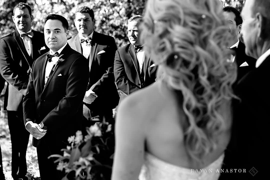 Groom seeing Bride walk down the aisle at the Homestead