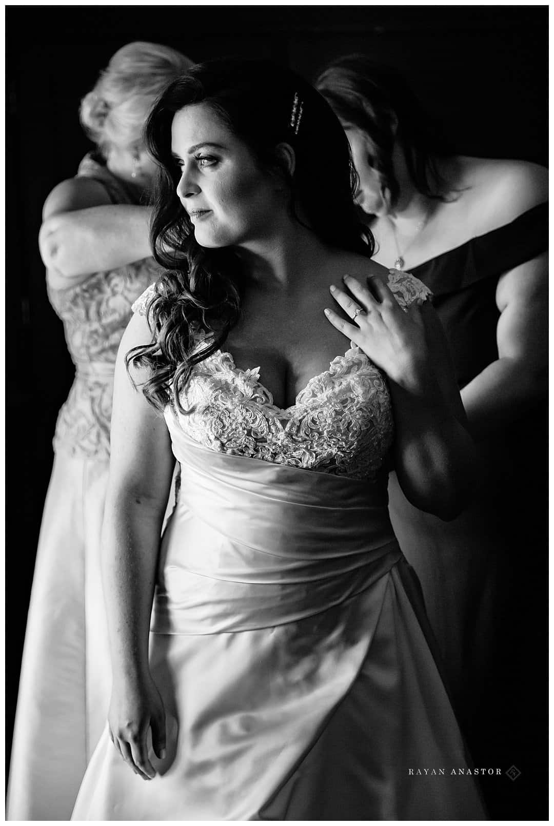 bride getting dressed at the Peninsula Room