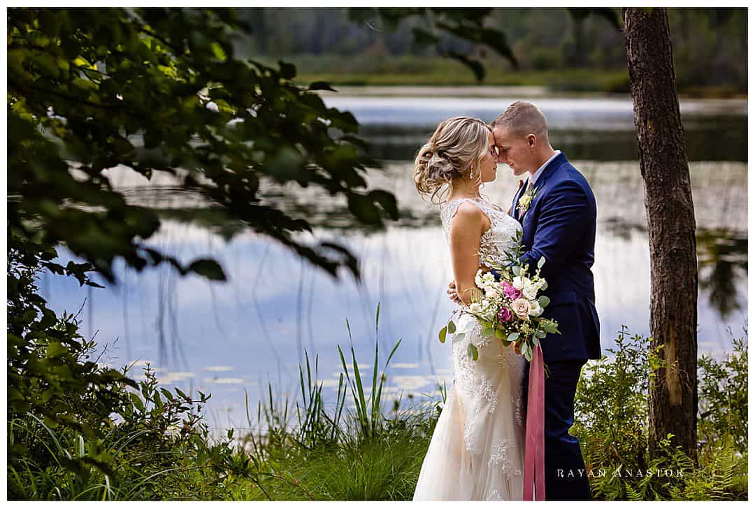 bride and groom at lake at Bluebridge events centre