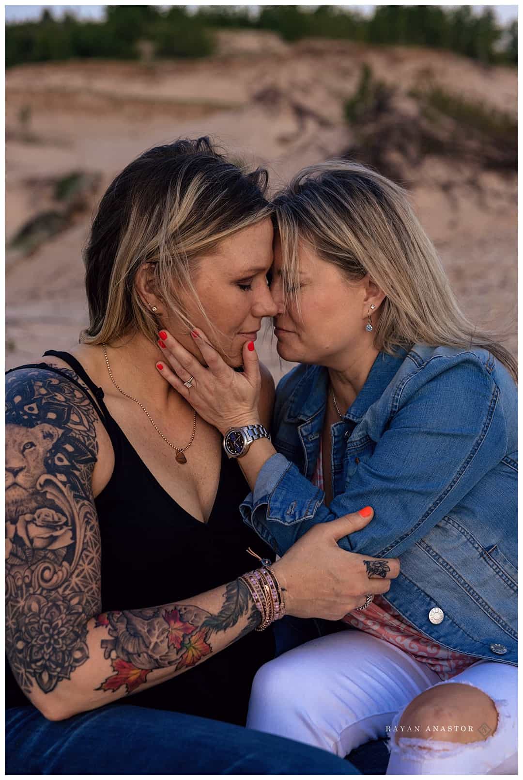 lesbian couple photo session in sand dunes