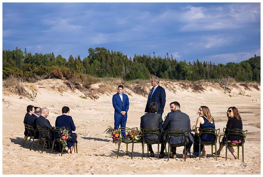 groom waiting for bride on the beach