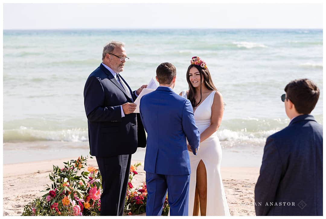 bride and groom getting married on Lake Michigan beach