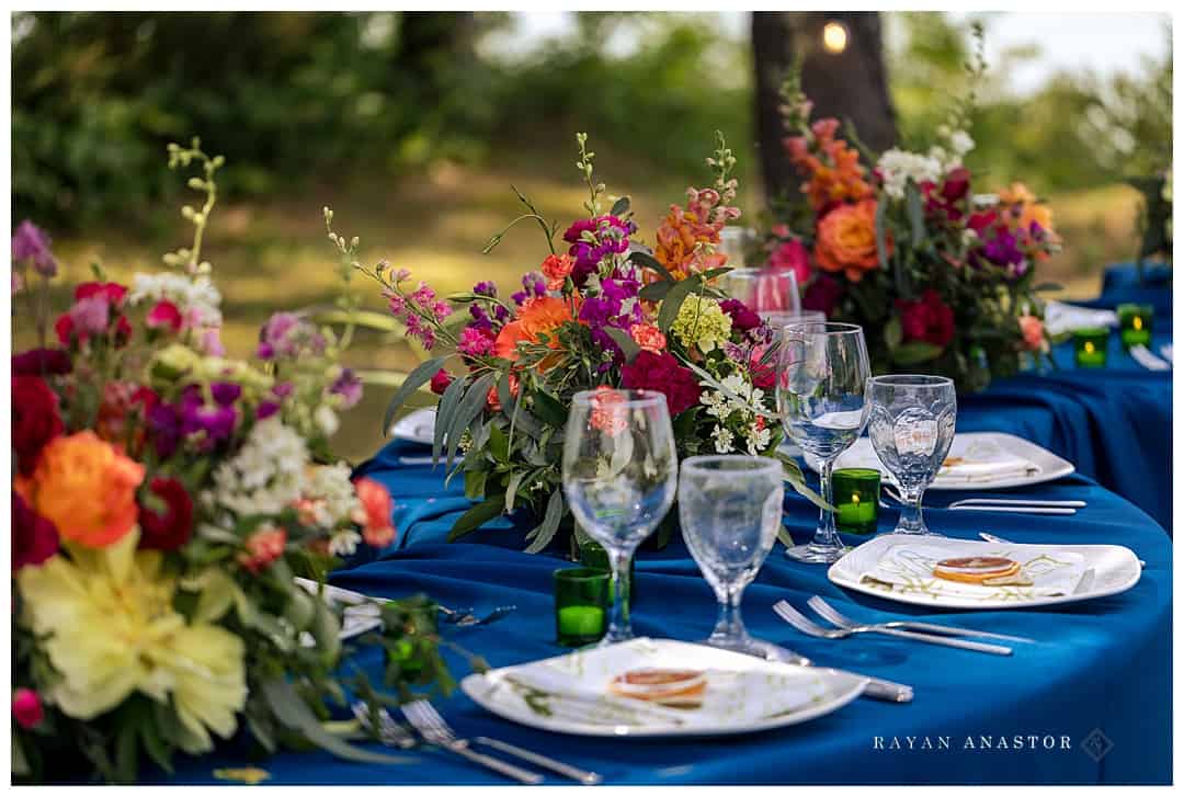 gorgeous blue tables cape with colorful flowers
