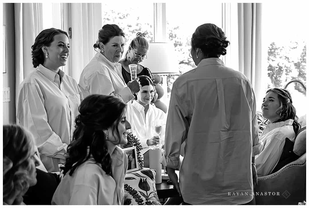 bride and bridesmaids enjoying the morning getting ready