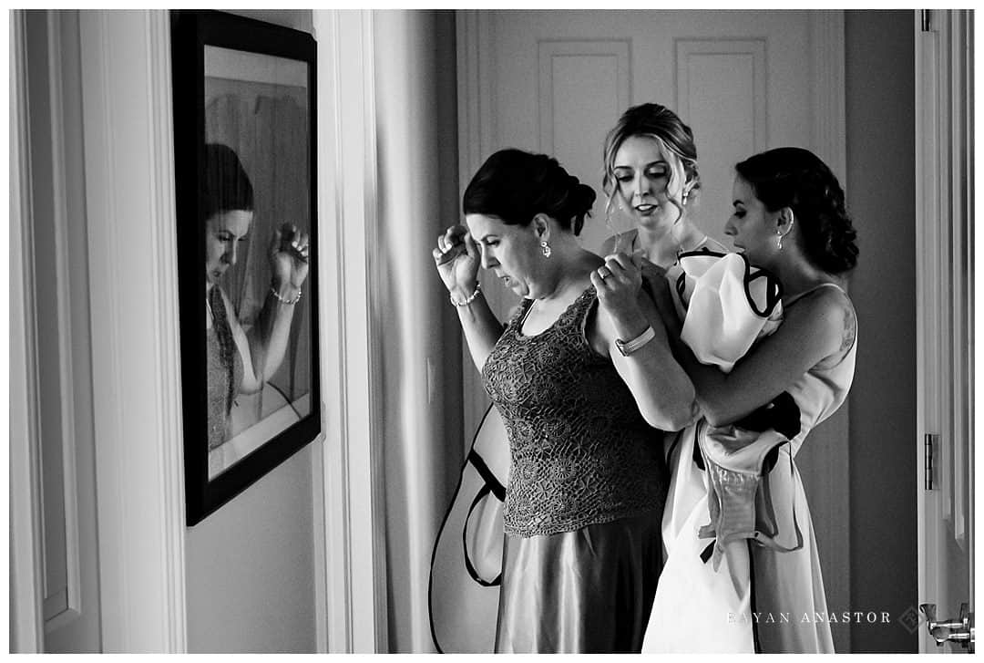 mother of bride getting dressed