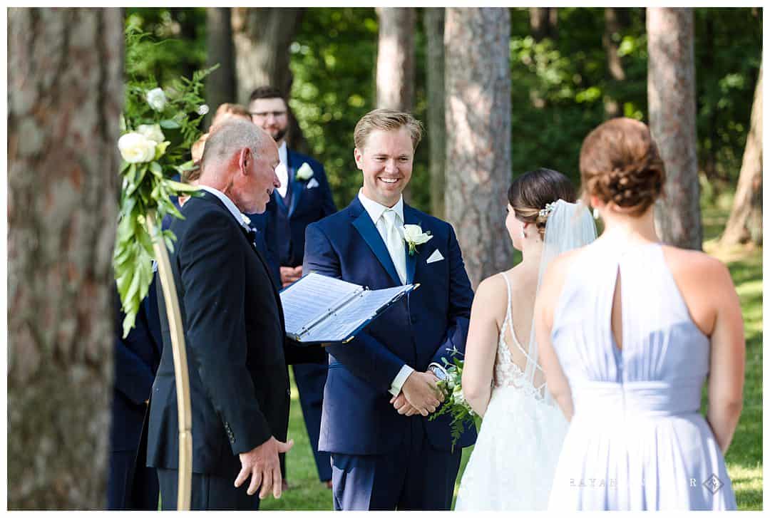 groom laughing at bride