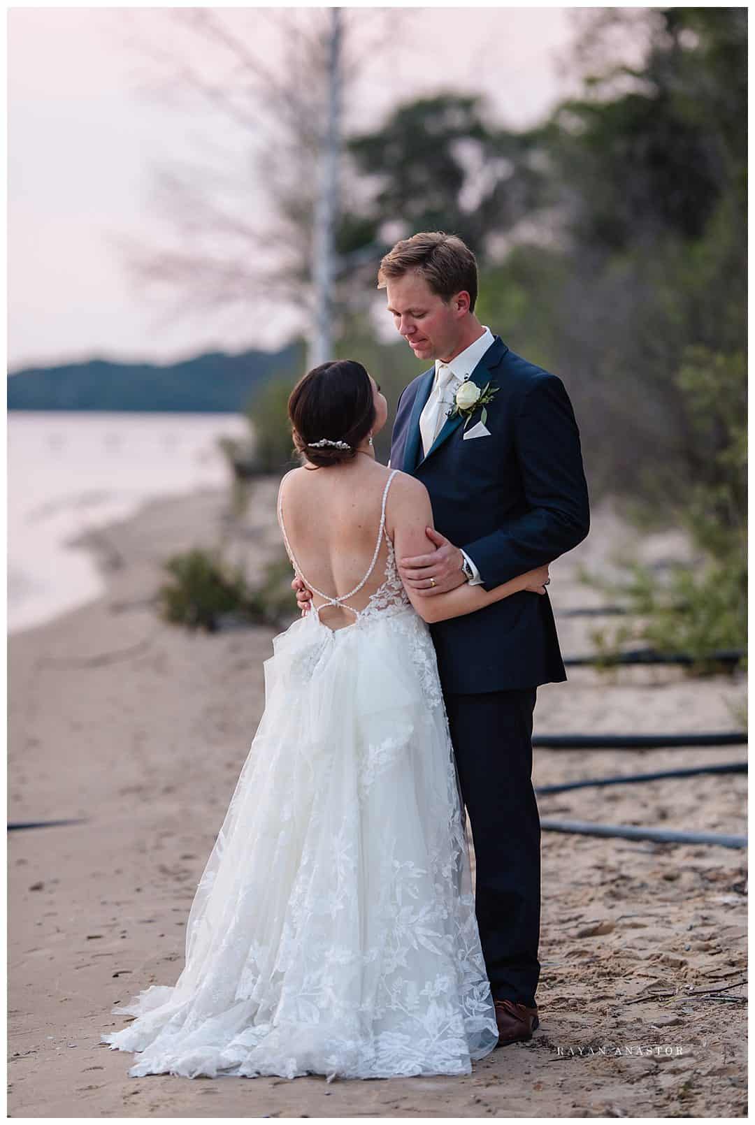 bride and groom on the lake shore