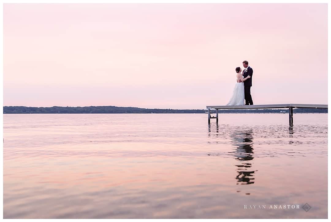 bride and groom on the lake during the haze from the California fires