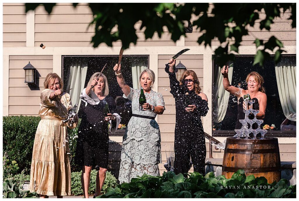 mother of groom sabering the wine