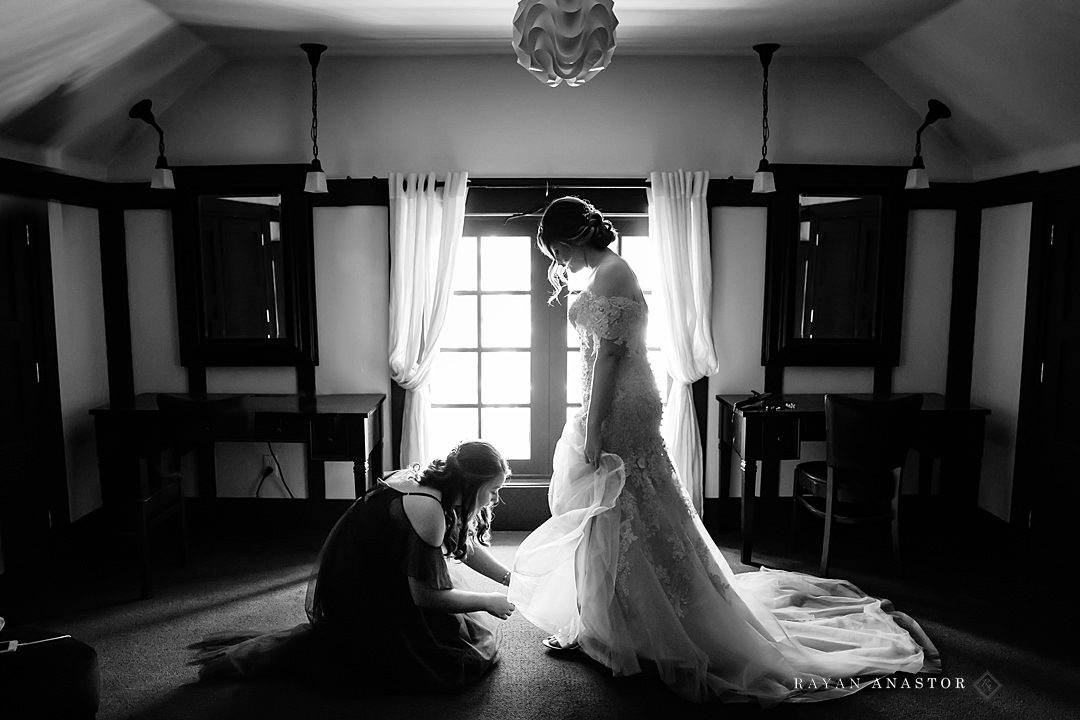 Bride getting shoes put on at the Bowers Harbor Inn