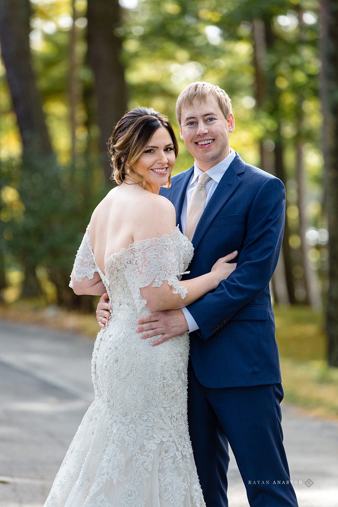 bride and groom wandering chateau Grand Traverse in the fall