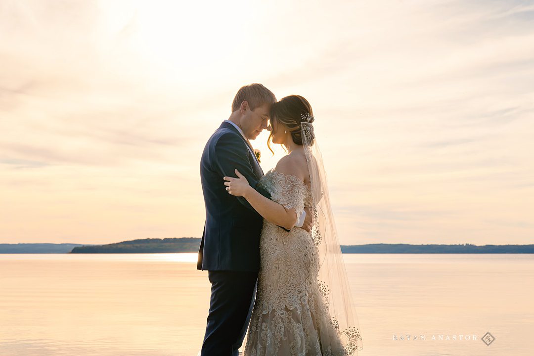 bride and groom on Lake Michigan at sunset