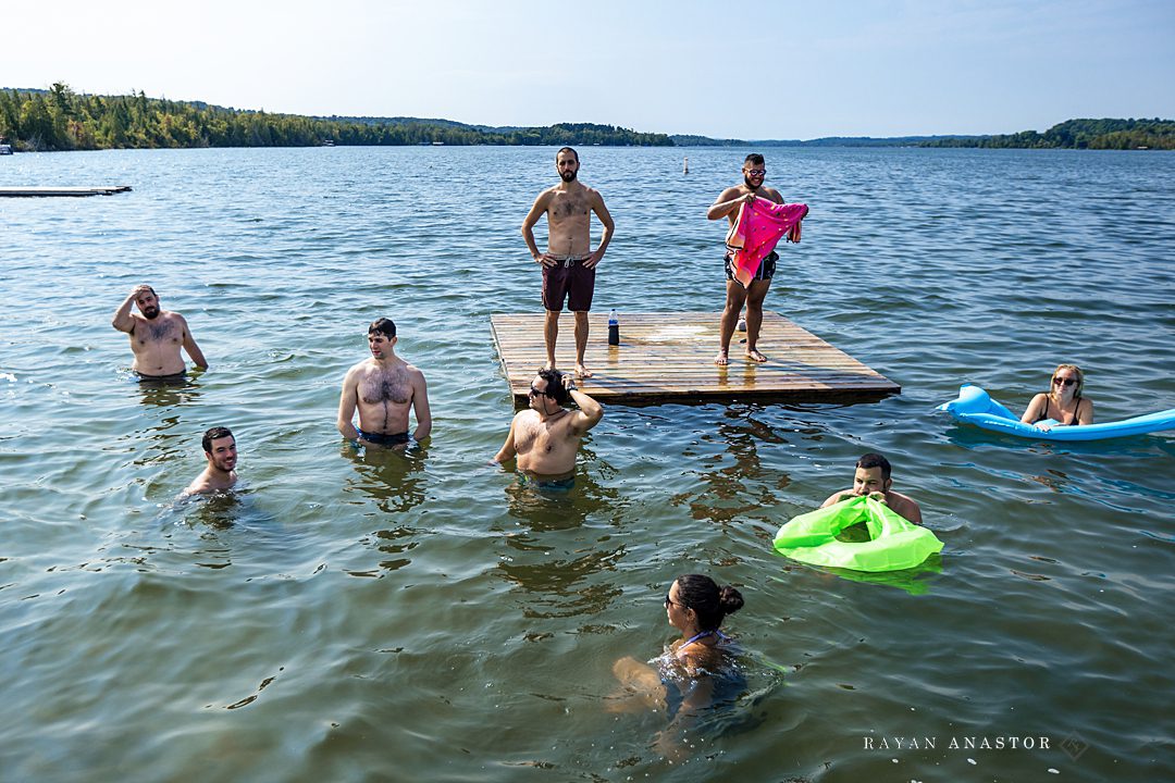 Wedding guests swimming in Lake Leelanau