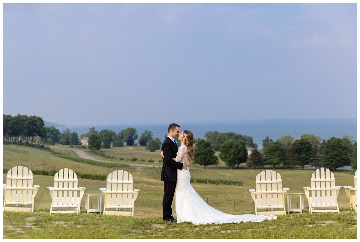 Mari Vineyard Wedding with bride and groom overlooking grand traverse bay