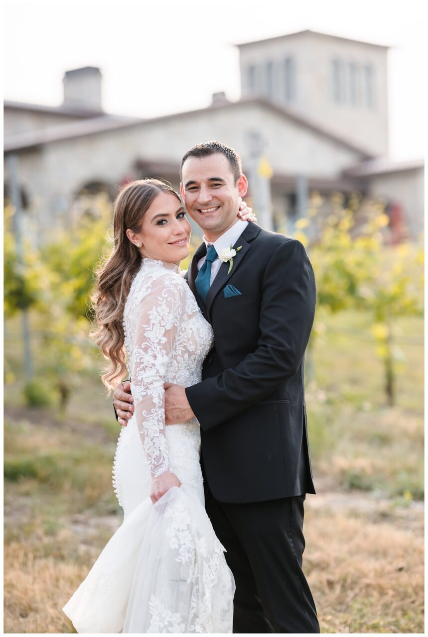 Mari Vineyard Wedding with bride and groom overlooking grand traverse bay