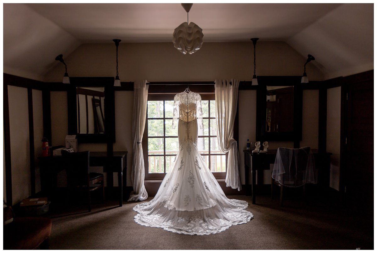 wedding gown hanging at mission table