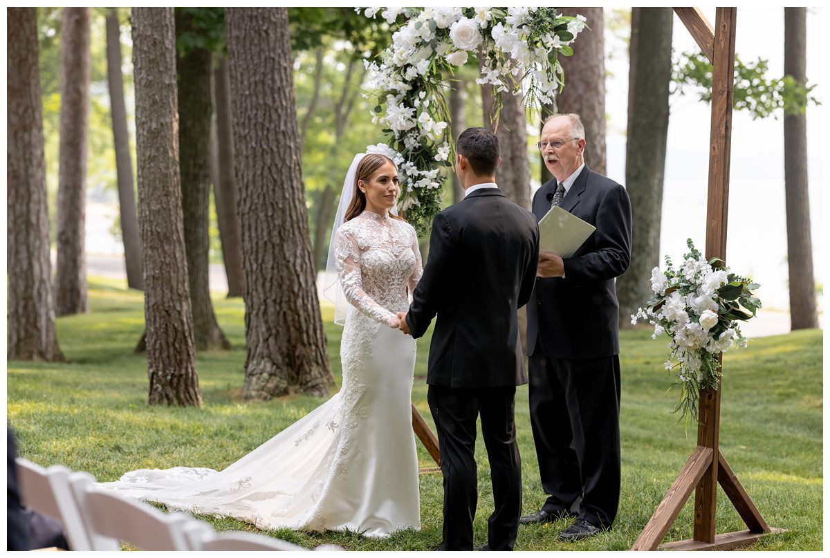 wedding ceremony on front lawn of mission table