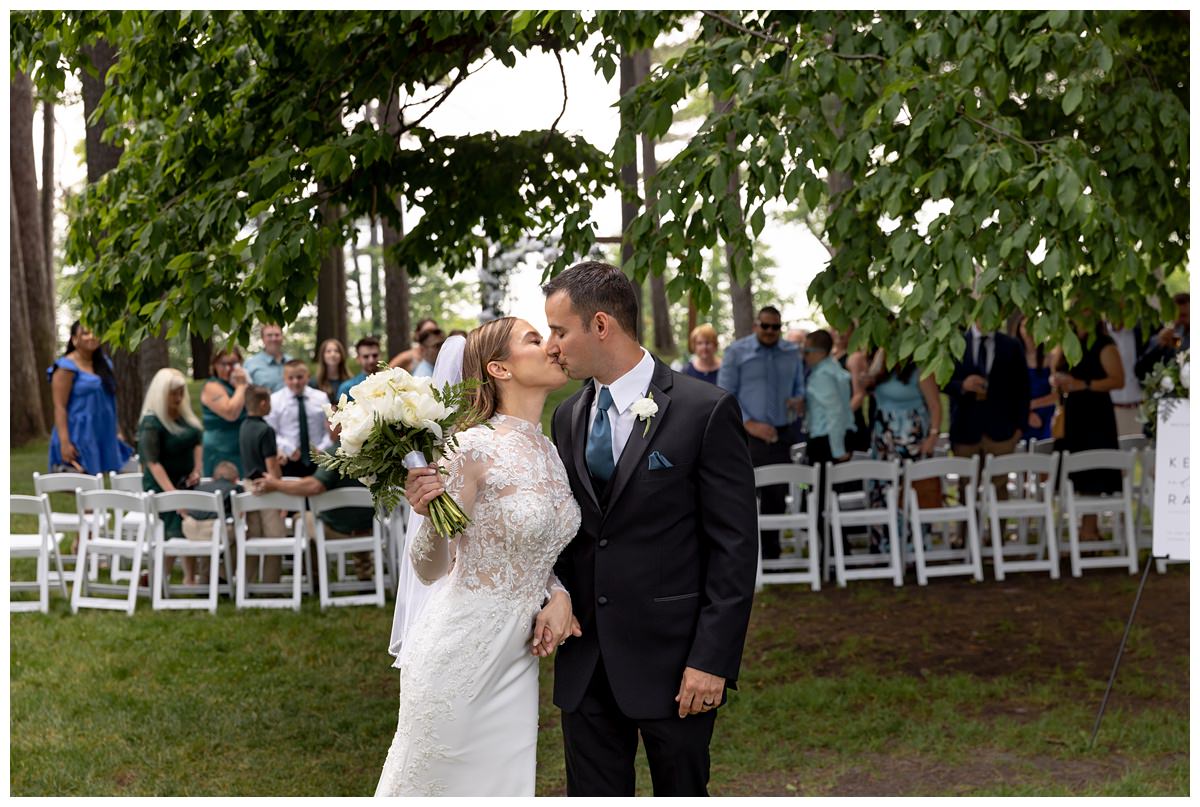 wedding ceremony on front lawn of mission table